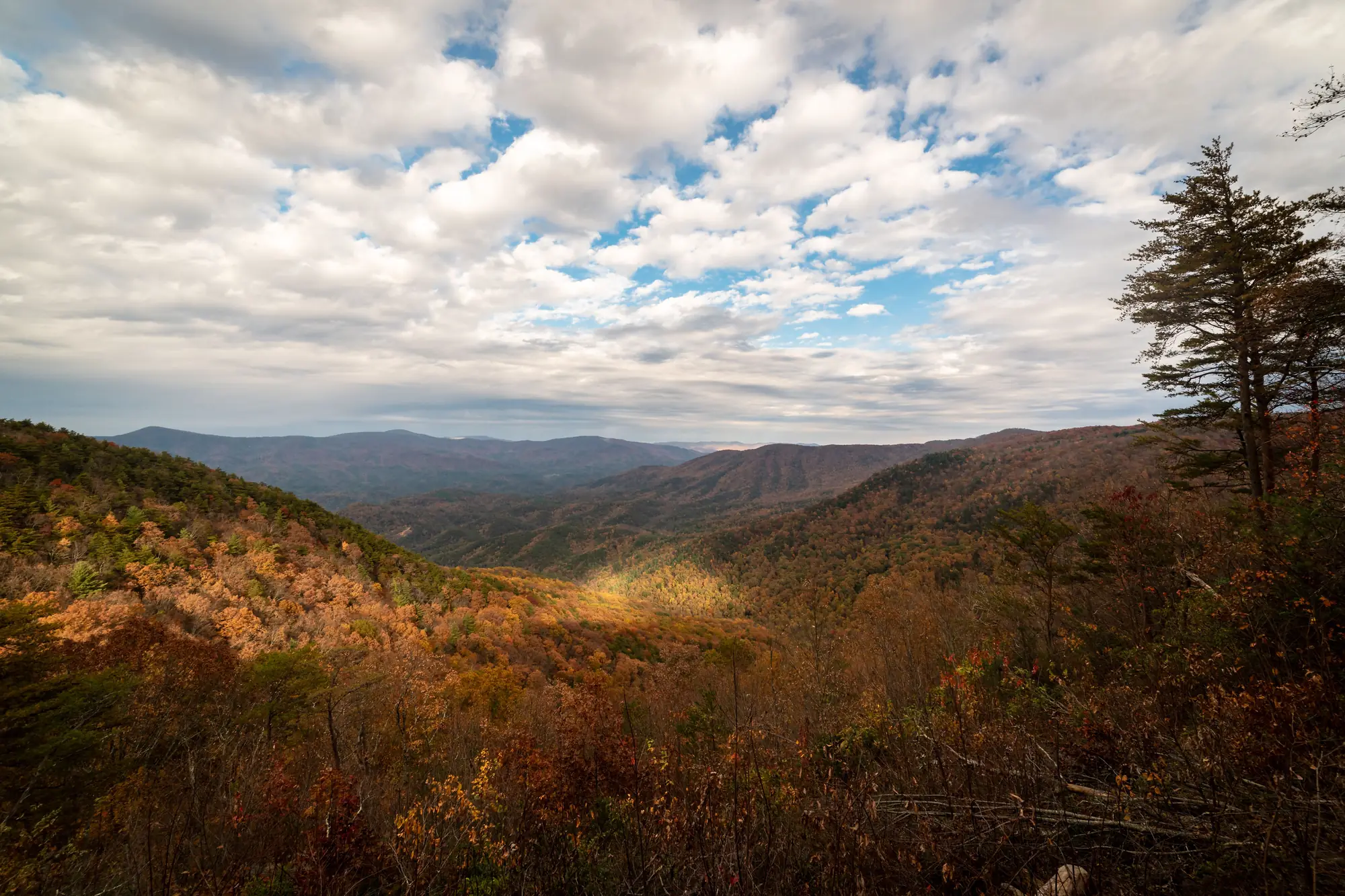 Autumn color across the north Georgia mountains near Hiawassee, with clouds over the ridges