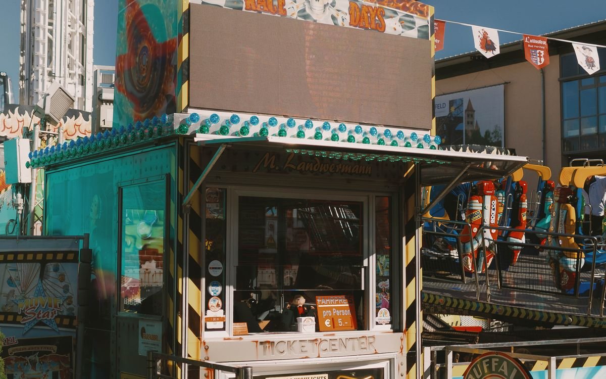 A colorful ticket booth at an outdoor attraction