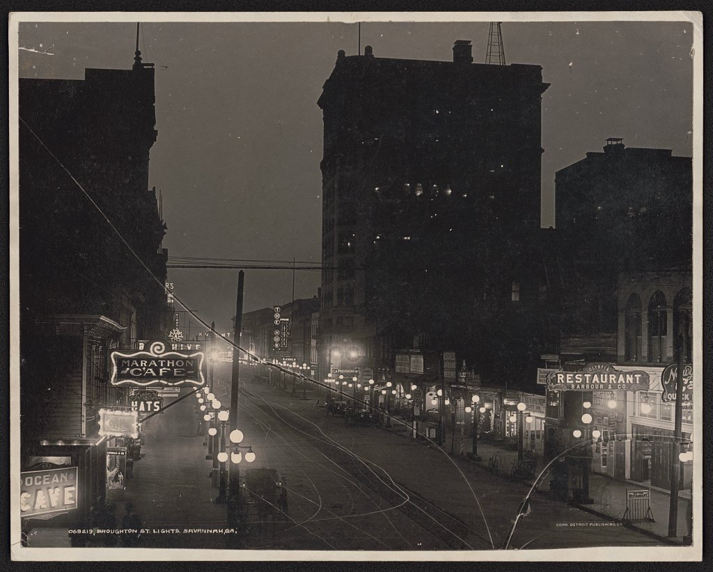 Broughton Street in Savannah at night with rows of street lights