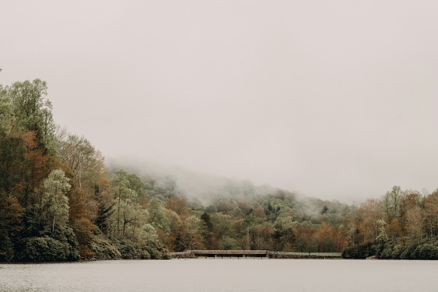 A misty lake with a small bridge below wooded Blue Ridge hills; photo is Price Lake on the Blue Ridge Parkway in North Carolina, not Blue Ridge, Georgia.