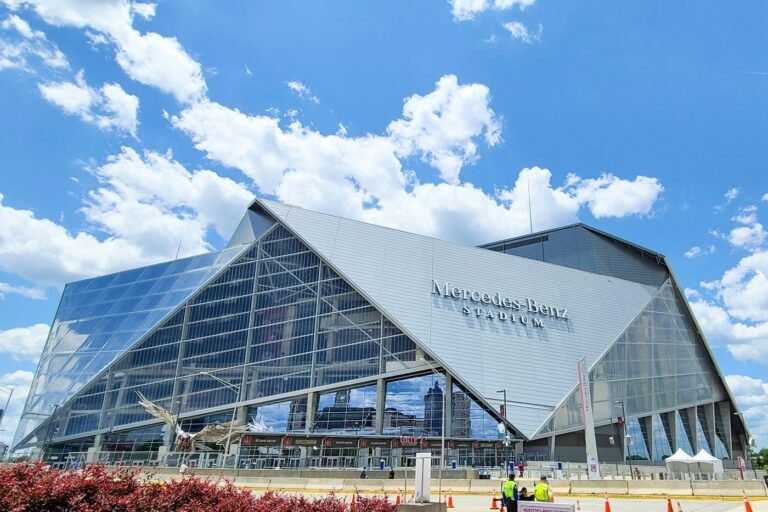 Mercedes-Benz Stadium in Atlanta, home of the Chick-fil-A Peach Bowl, seen from the plaza on a sunny day
